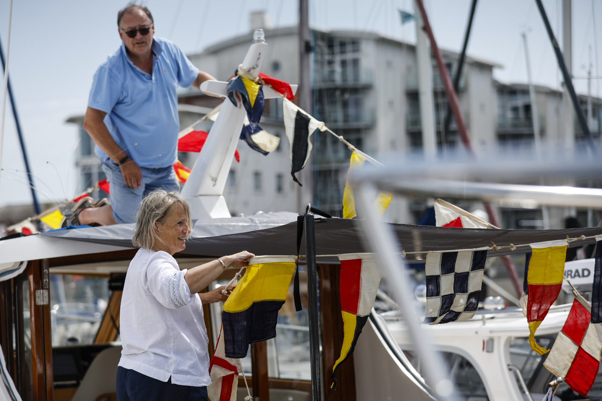 Decorating the Duchy motorboats with flags